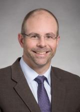 This is a headshot picture of Lauge Sokol-Hessner.